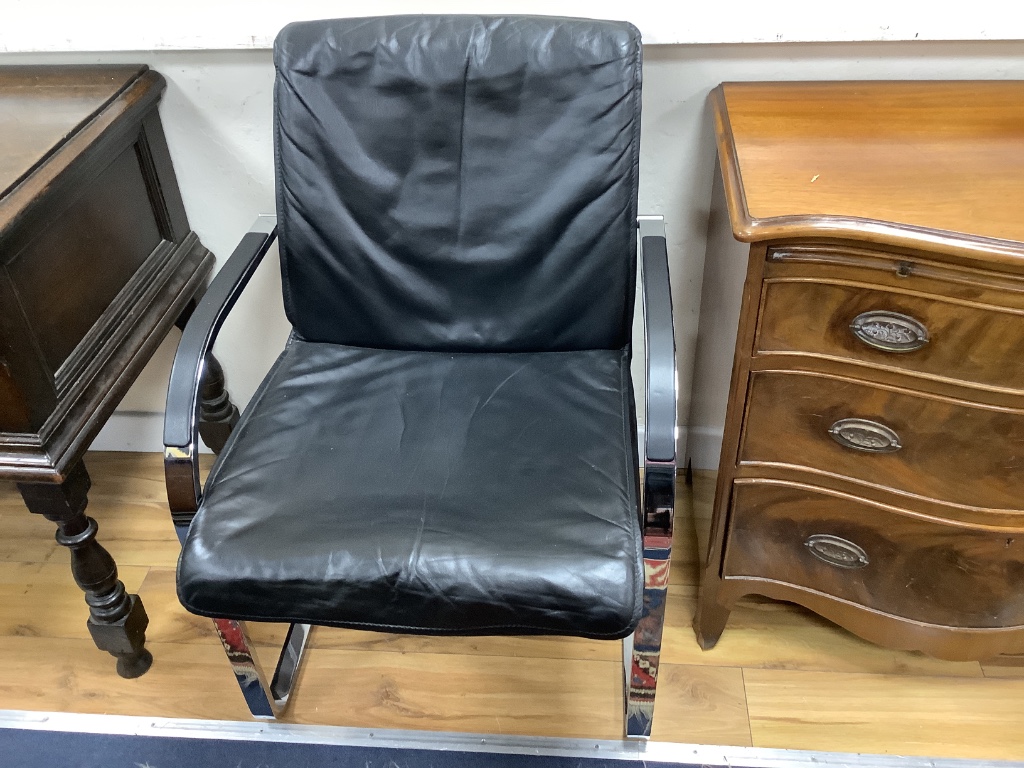 A pair of Knoll International Mies Van De Roue chrome and black leather cantilever elbow chairs, width 58cm, depth 64cm, height 86cm